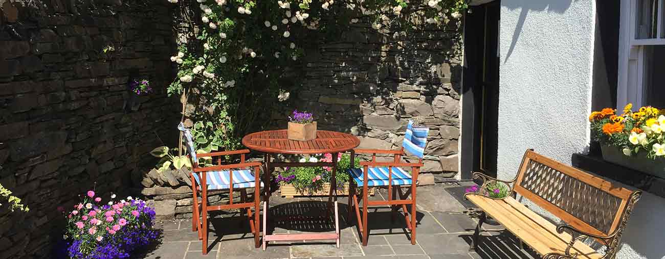 Lowfield patio in the sun - Lake District self-catering